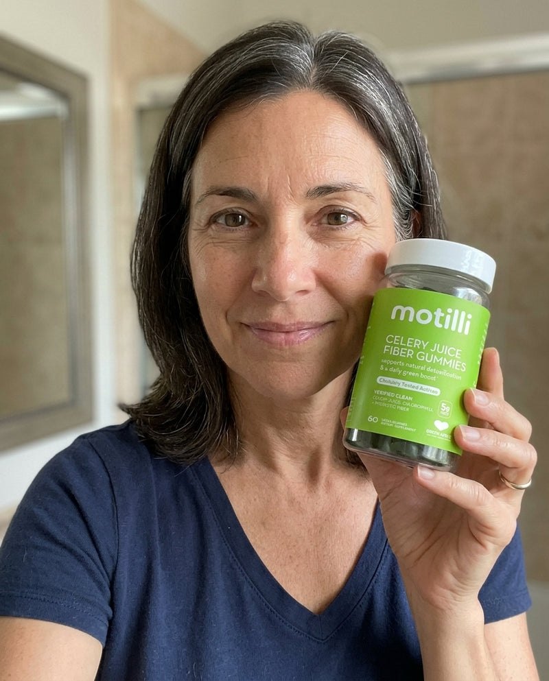 Woman holding a bottle of Motilli